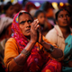 An Indian Dalit woman, a member of the outcast community once known as untouchables, listens to a speaker with folded hands at a sit-in protest on Human Rights Day near the Indian Parliament in New Delhi on Dec. 10, 2013. The Dalits were demanding rights to land, livelihood and equal growth opportunities. (Altaf Qadri/AP Images)